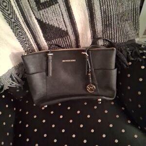 Michael Kors Elegant Black Tote with Gold Details.